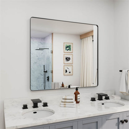 Angled large black framed bathroom mirror for vanity