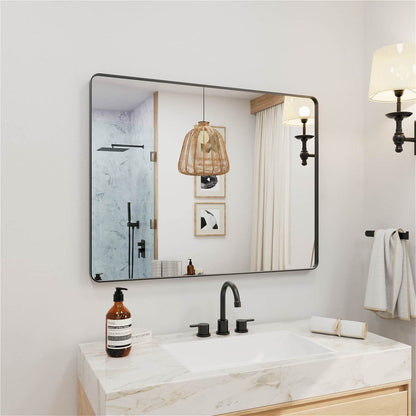 Angled mounted black framed rectangular vanity mirror