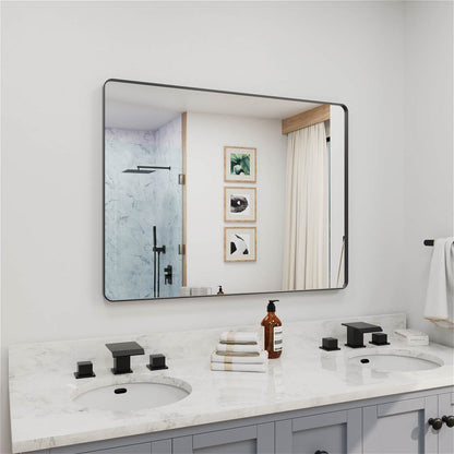 Angled oversized black framed rectangular bathroom mirror
