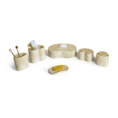 Beige marble bathroom accessories set with lidded containers and soap dish