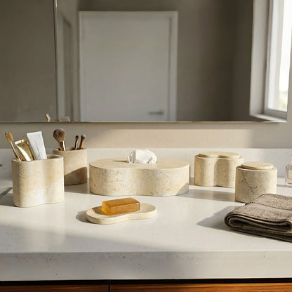 Beige marble vanity accessories set for bathroom storage and styling