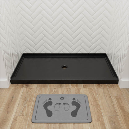 Black shower base with anti slip pattern and tapered floor design