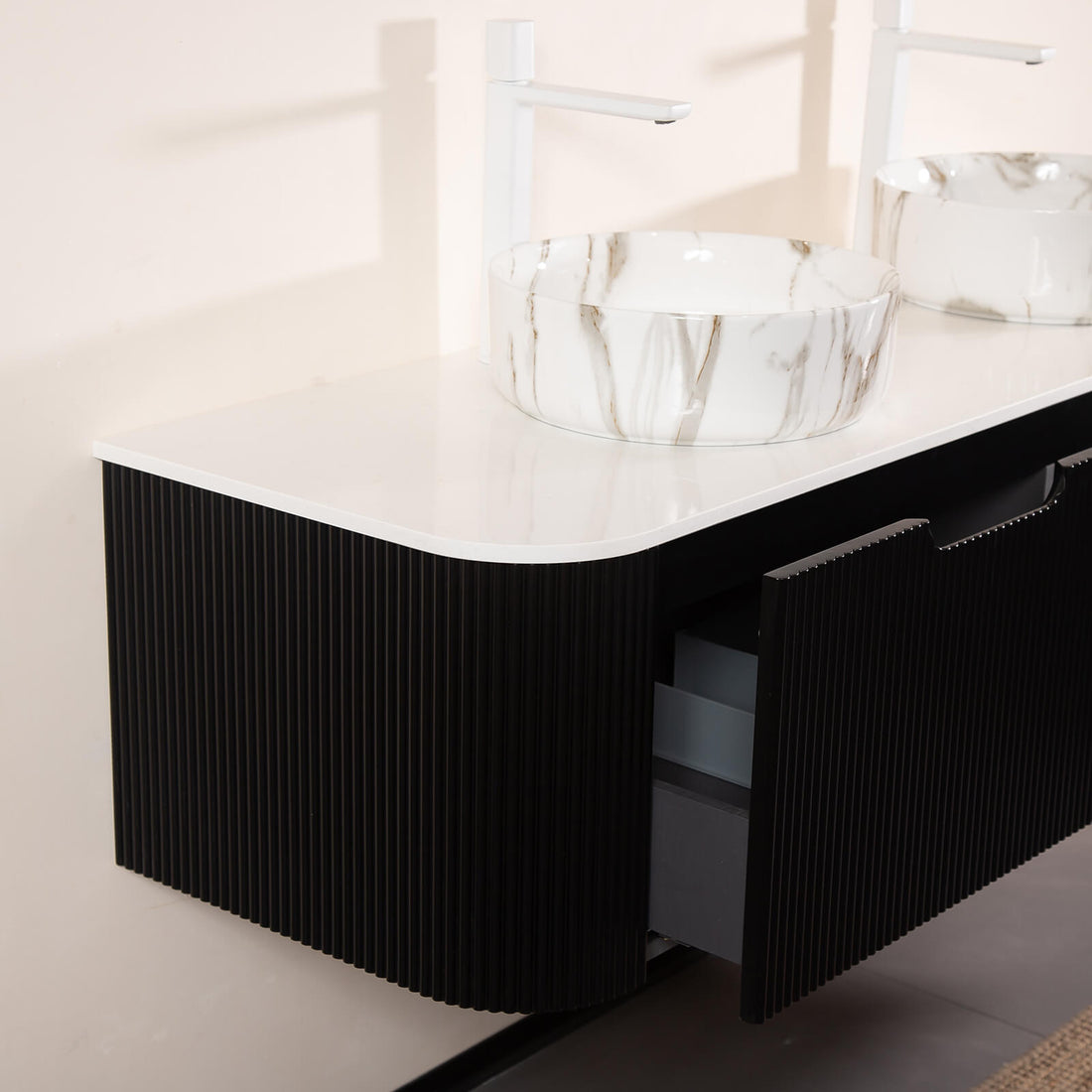 Black vanity with dual stone veined ceramic basins