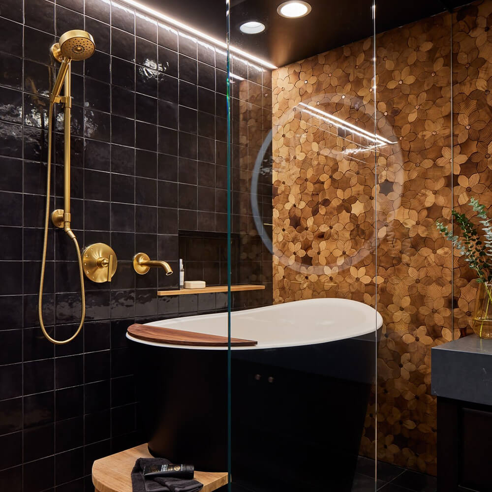 Black Japanese soaking tub installed in small bathroom