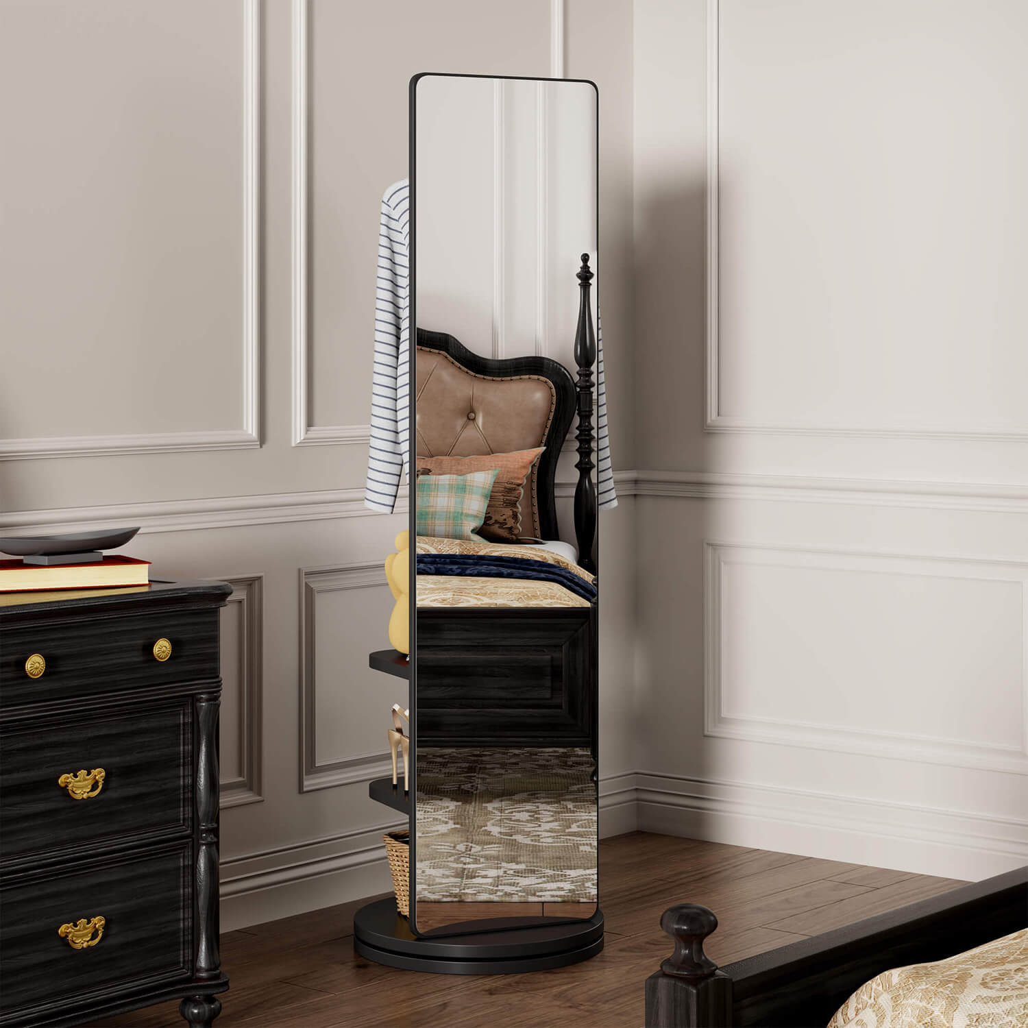 Black rotating mirror reflecting vintage bedroom furniture