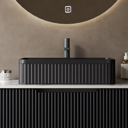 Black rectangular ceramic above-counter bathroom sink with a full front vertical ribbed exterior above-counter installation design