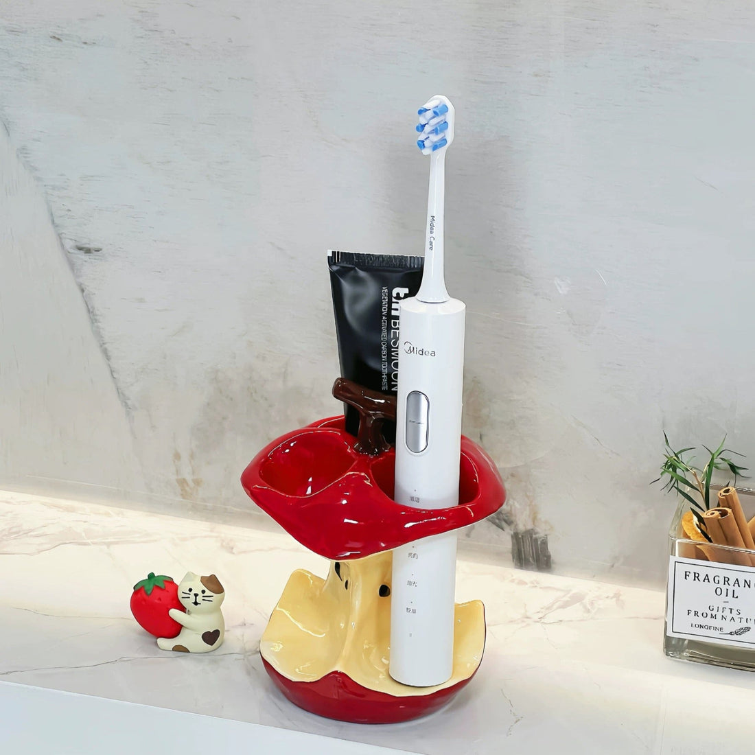 Ceramic toothbrush holder shaped like apple core