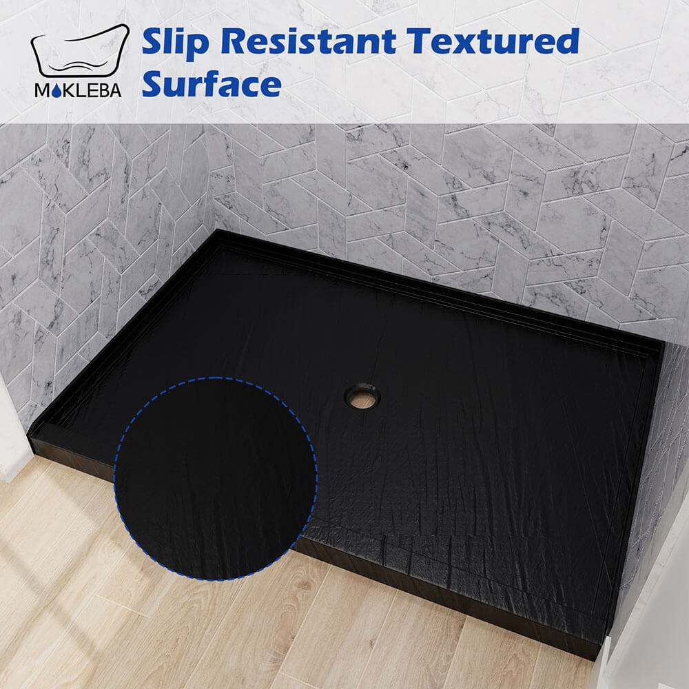 Close-up of anti-slip surface texture on black acrylic shower base