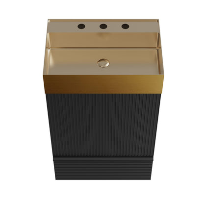 Close-up of brushed gold stainless steel sink on black bathroom vanity