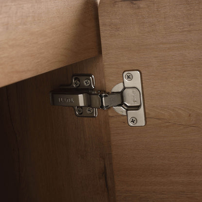 Close-up of stainless steel soft-close hinges on the 60 inch white oak bathroom vanity