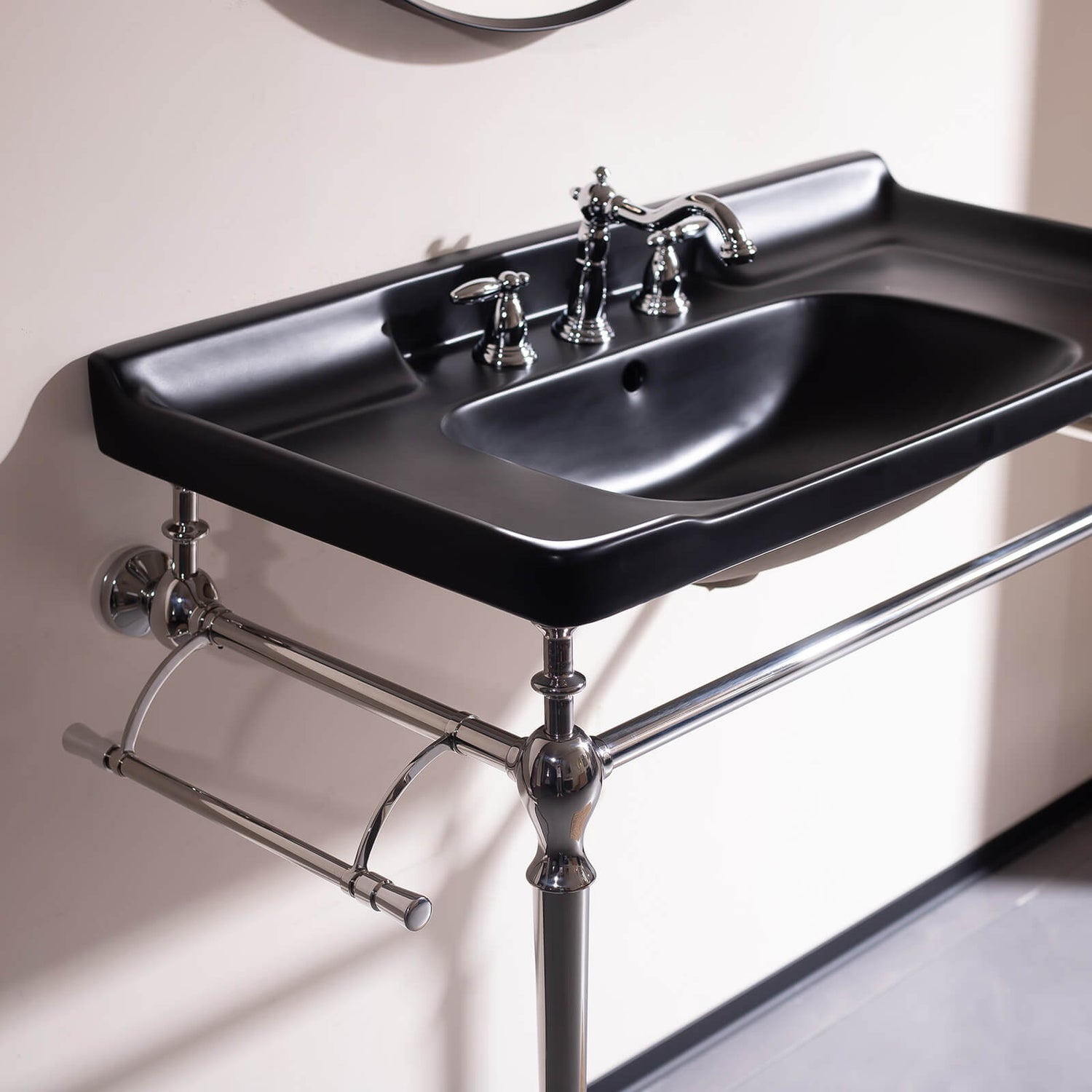 Contemporary black ceramic sink with chrome supports   freestanding vanity for modern bathrooms