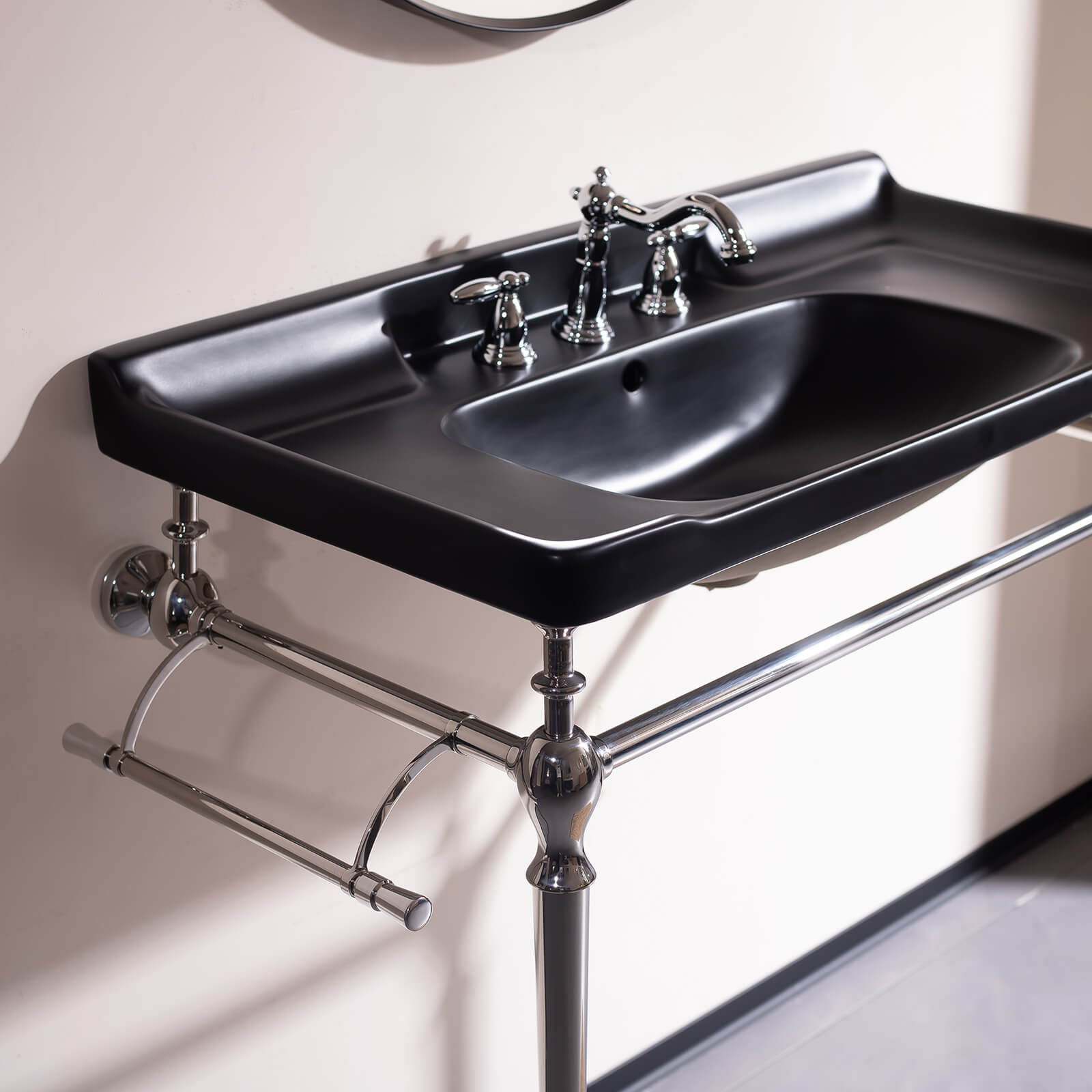 Contemporary black ceramic sink with chrome supports   freestanding vanity for modern bathrooms