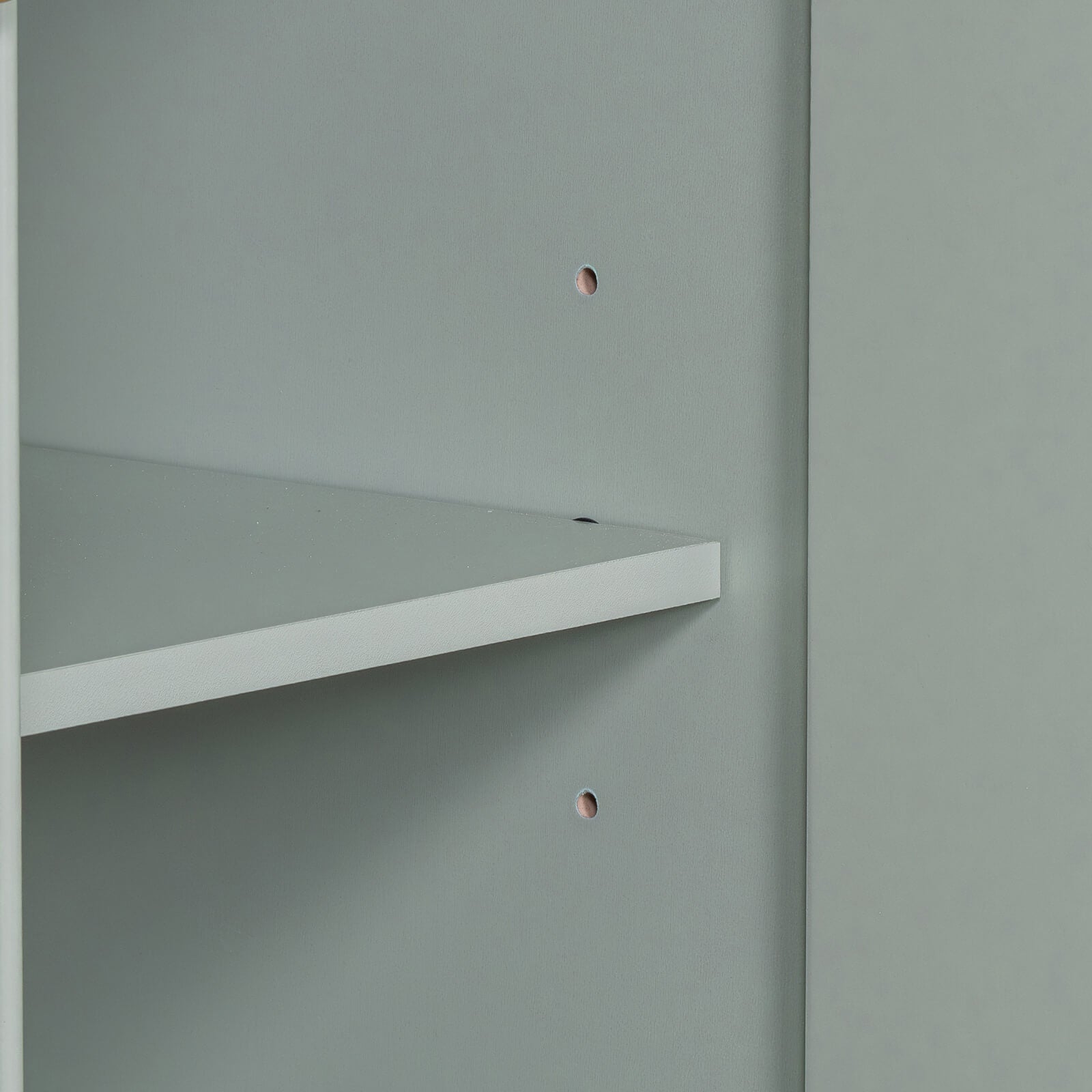 Detail of the adjustable shelves in the 36 inch light lime green bathroom vanity cabinet