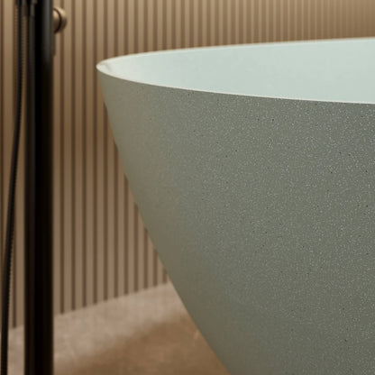 Double freestanding bathtub in bold turquoise finish with smooth polished surface