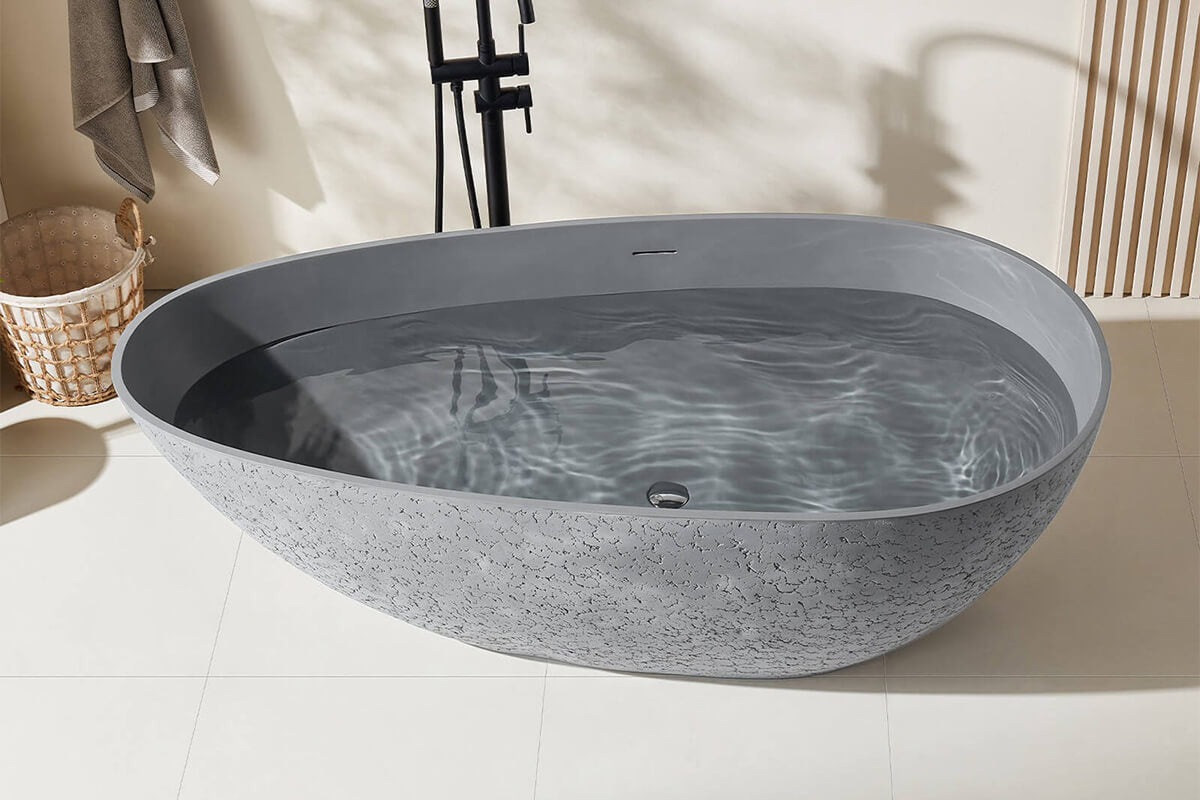 Egg-shaped cement grey bathtub