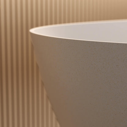 Elegant beige solid surface bathtub with seamless polished finish