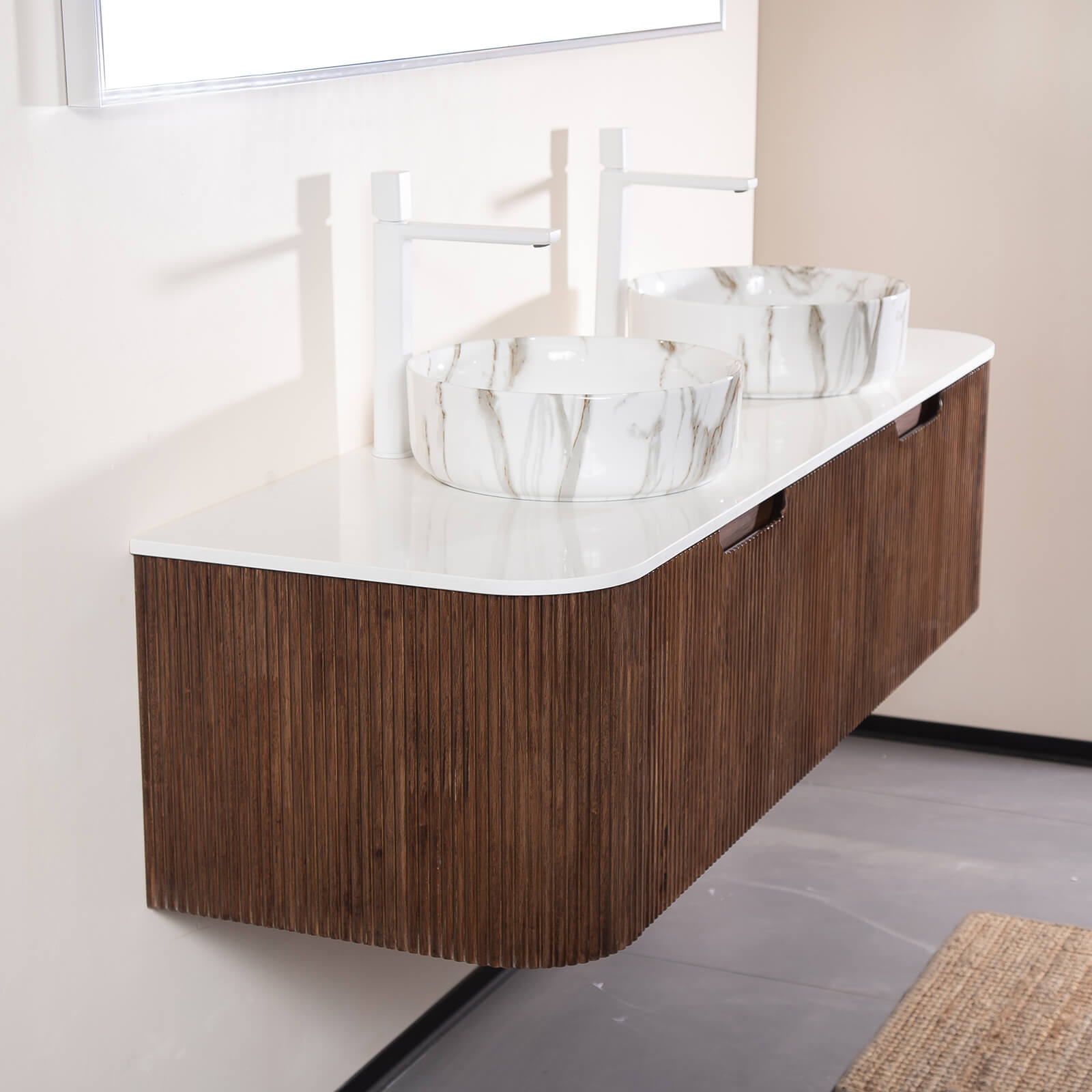 Engineered white marble countertop on walnut vanity