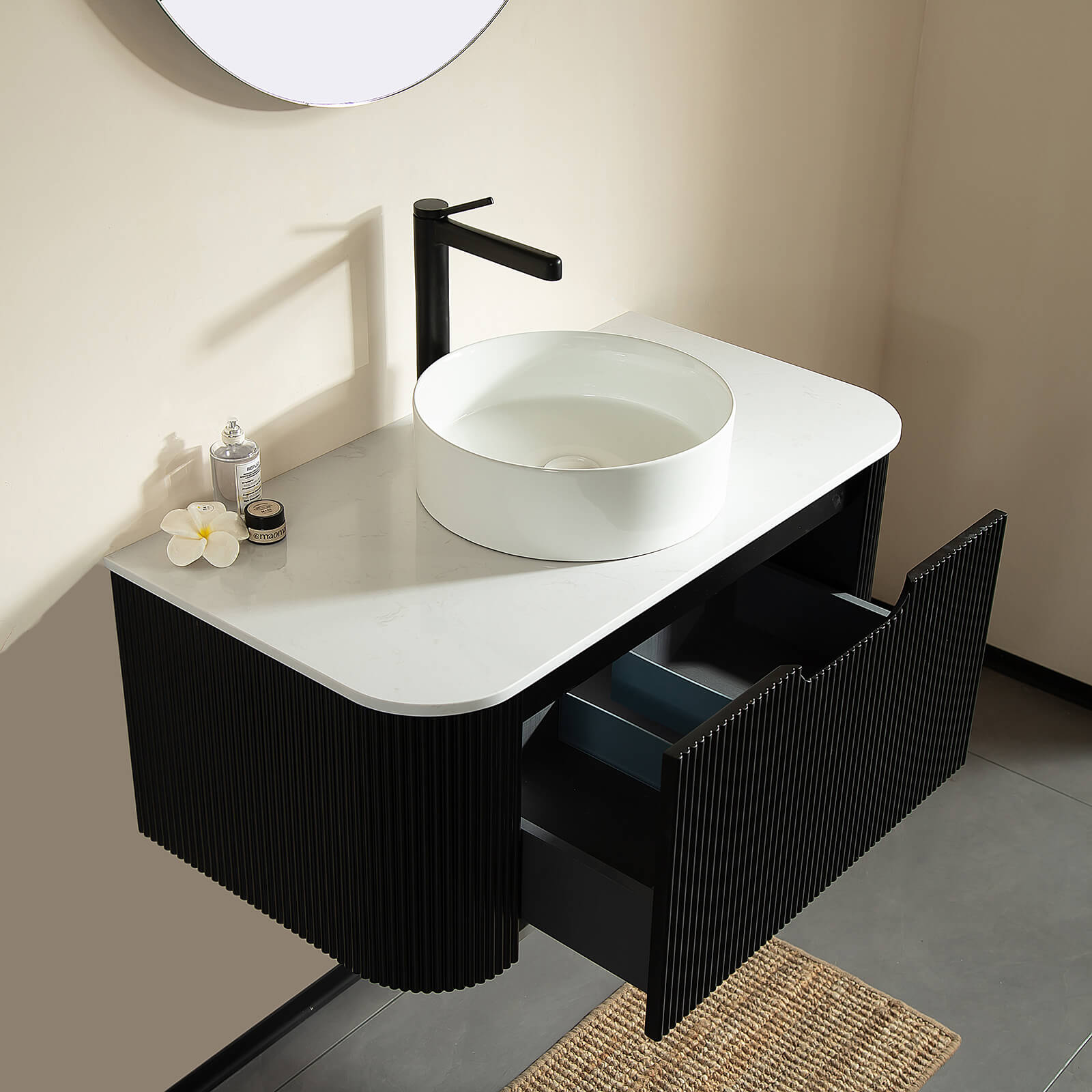 Floating vanity with curved edges and engineered marble countertop