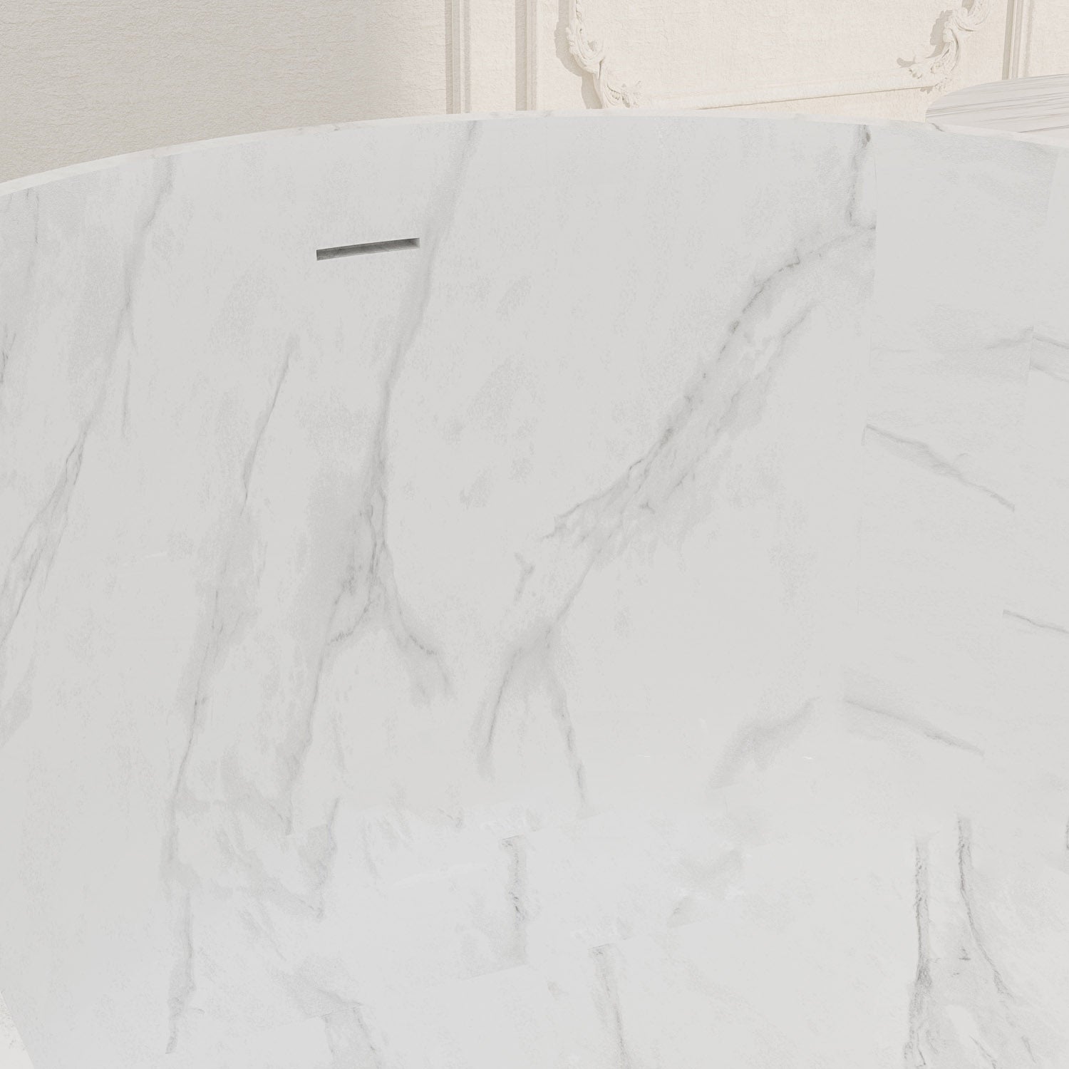 Freestanding white bathtub with integrated overflow system