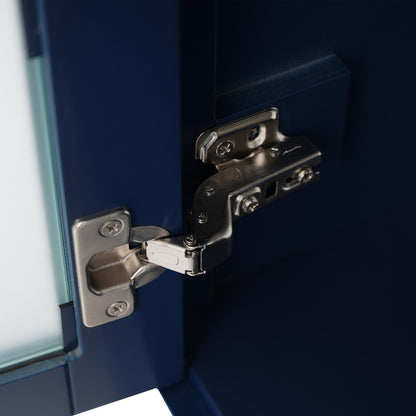 Hinge detail of 20 inch blue dresser with frosted glass door