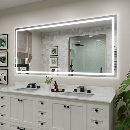 Large LED vanity mirror with perimeter light strip and touch controls at the bottom right