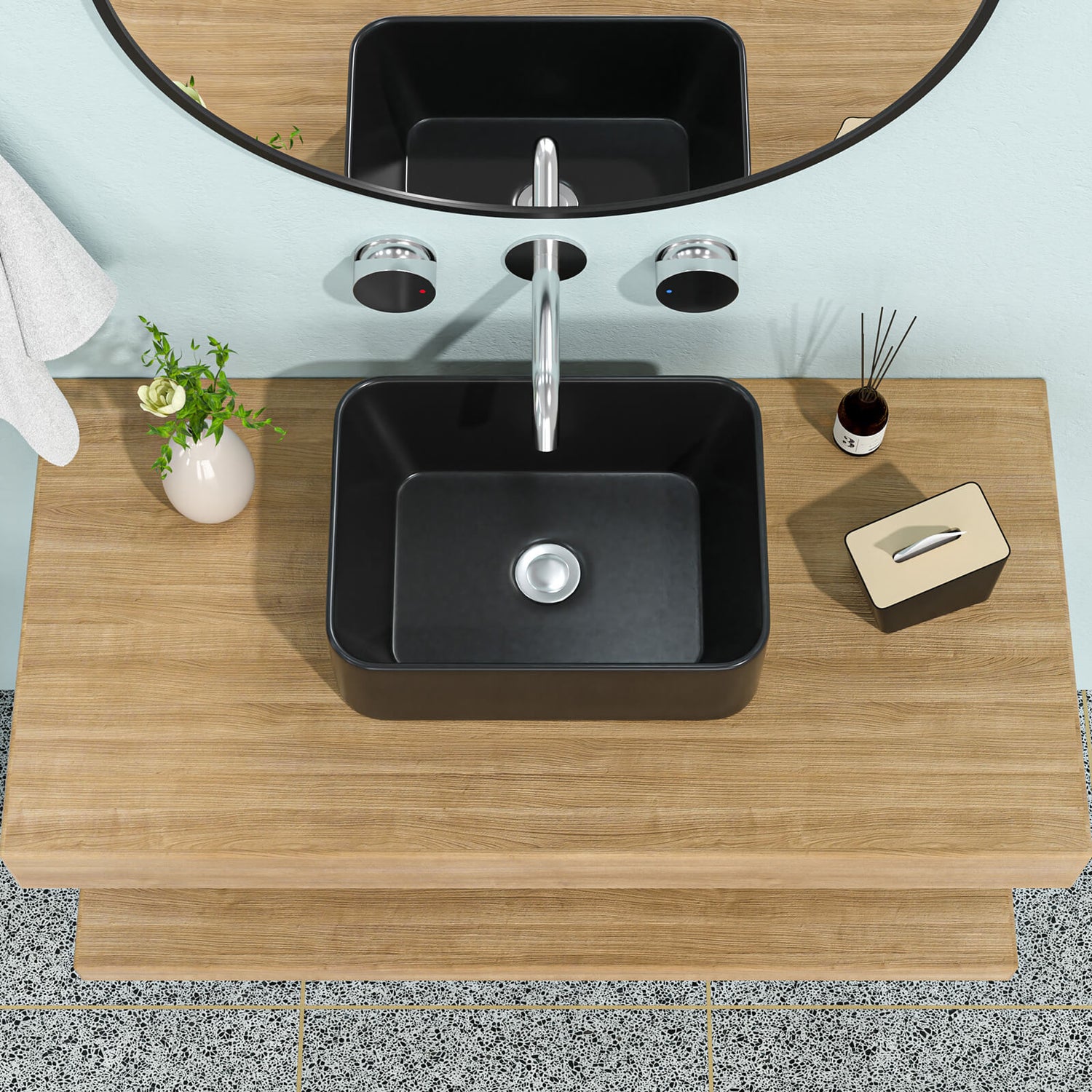 Matte black ceramic vessel sink with rounded rectangular design