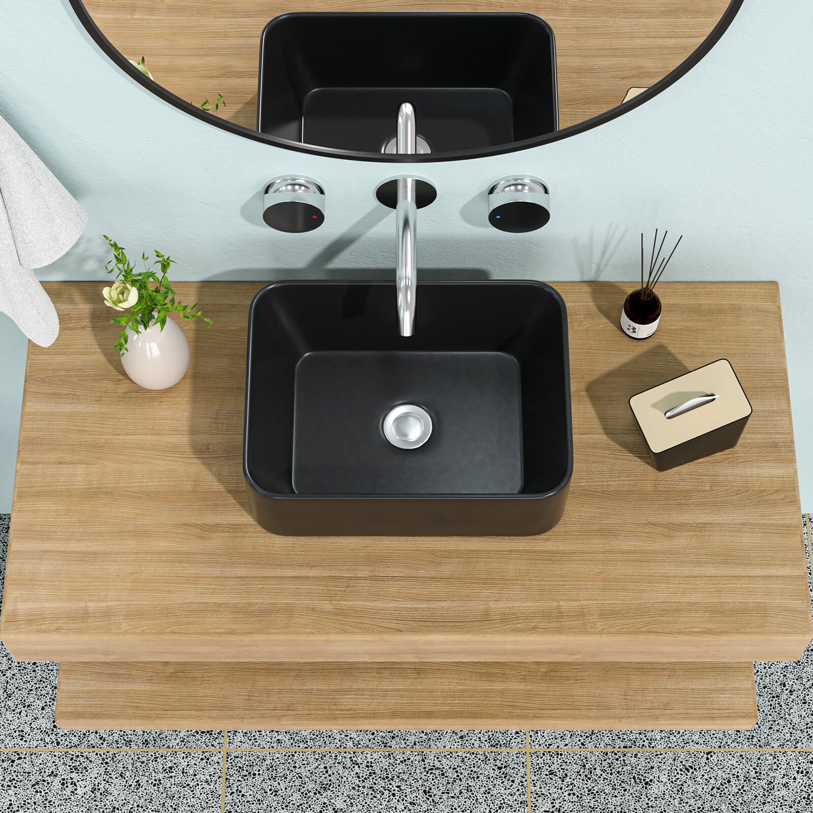 Matte black ceramic vessel sink with rounded rectangular design