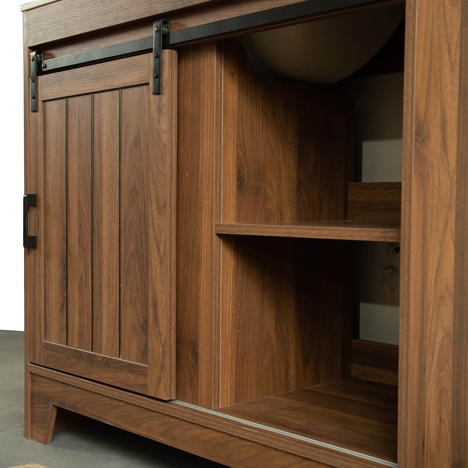 Matte black handles and tracks on farmhouse vanity door