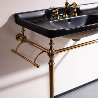 Modern 36 black ceramic vanity sink with integrated towel bars and gold accents in