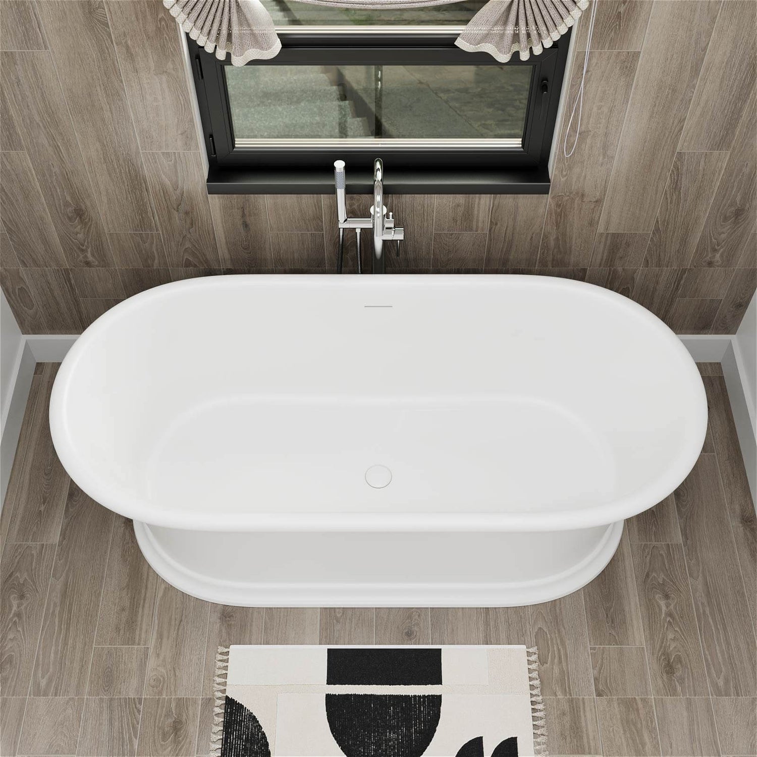Modern soaking tub with pedestal base and central drain