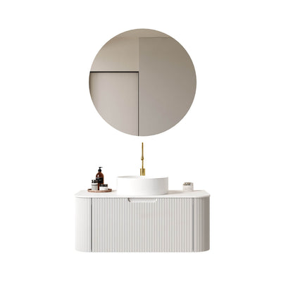 Modern white floating bathroom vanity with round ceramic vessel sink and marble countertop