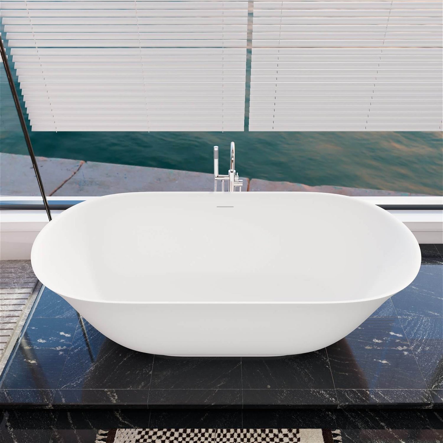 Modern white freestanding bathtub with a smooth solid surface finish