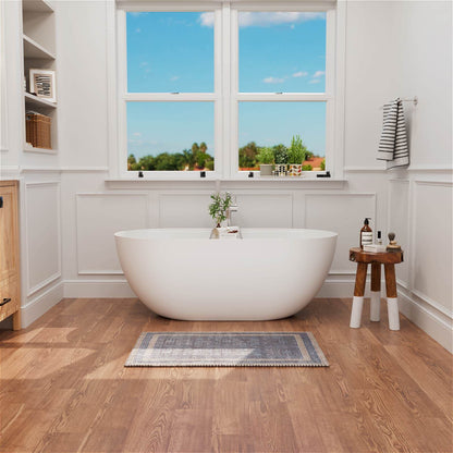 Oval solid surface soaking tub with modern spa style look