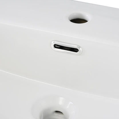 Overflow detail on 20 inch blue vanity with frosted glass door