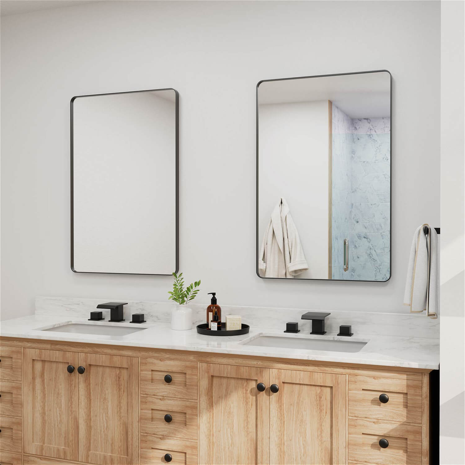 Pair of black framed rectangular bathroom mirrors wall mounted