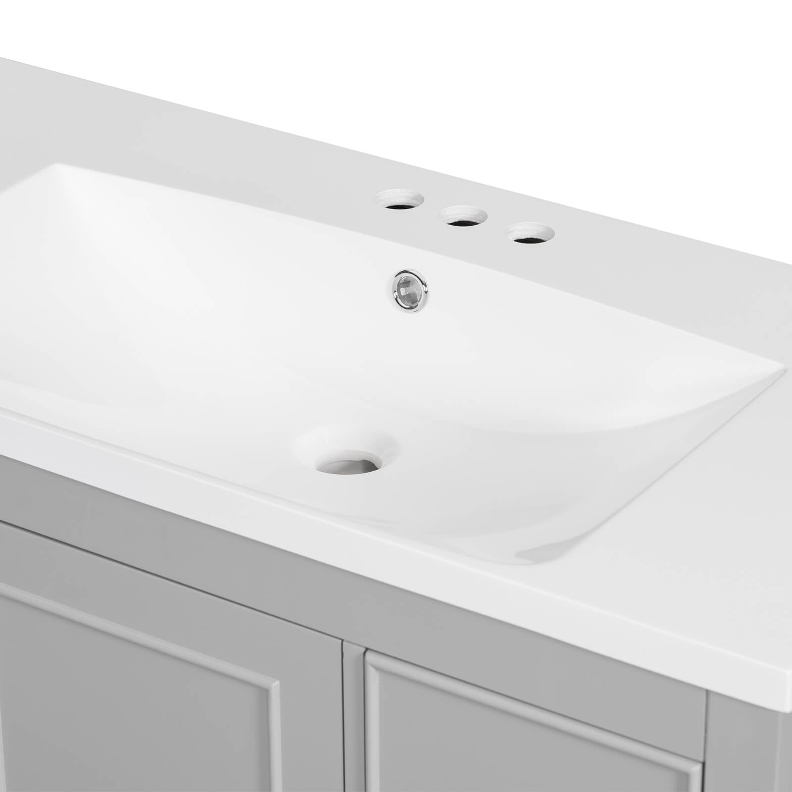 Seamless resin sink atop a 36-inch gray bathroom vanity for easy maintenance