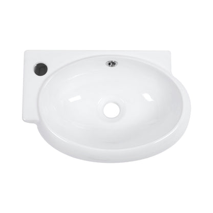 Sleek oval sink installed on bathroom wall with no counter