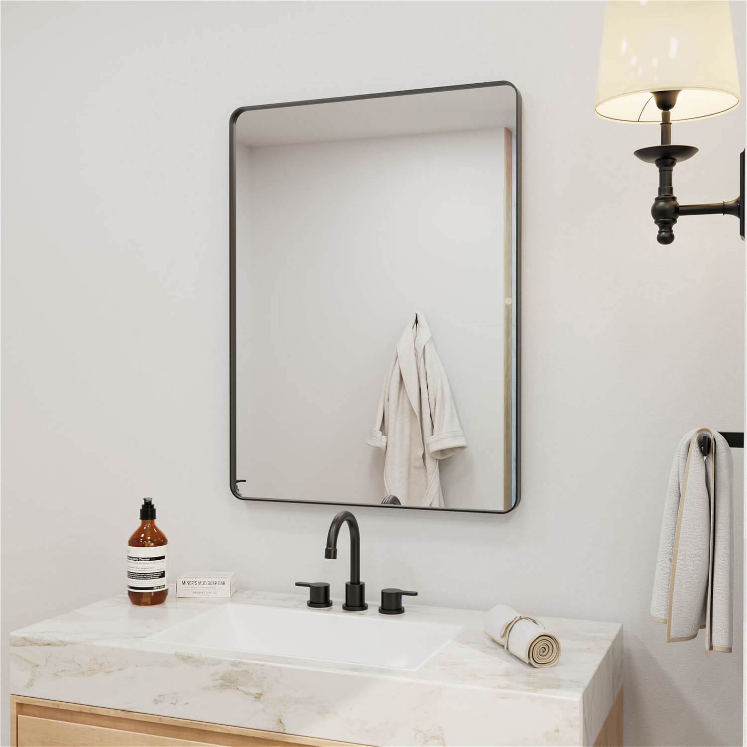 Slim profile black framed rectangular bathroom mirror with clear surface