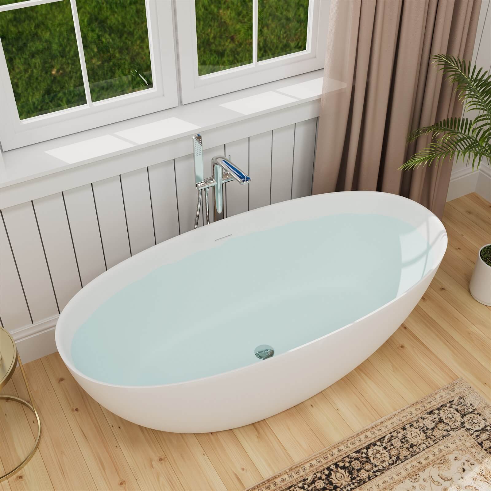 Spacious freestanding bathtub with romantic soaking experience