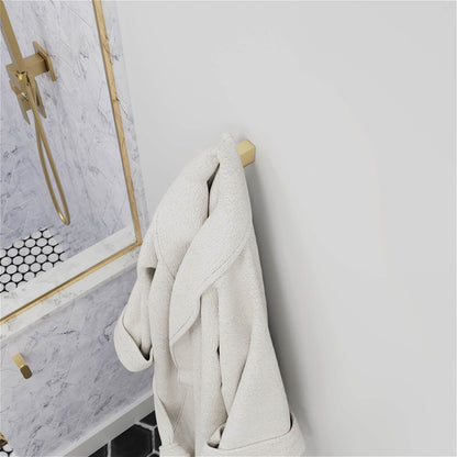 Two brushed gold robe hooks on white bathroom wall
