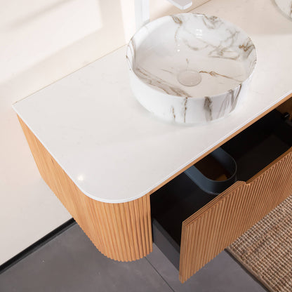 Wall mounted floating vanity with two stone veined ceramic sinks