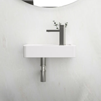 White bathroom sink with right side faucet hole and towel bar