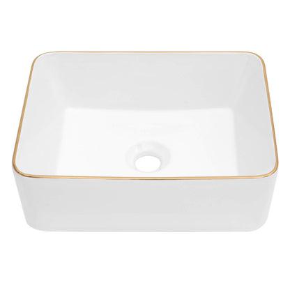 White ceramic bathroom sink with luxurious gold trim edge