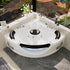 White acrylic corner whirlpool tub with stainless steel armrests and headrests