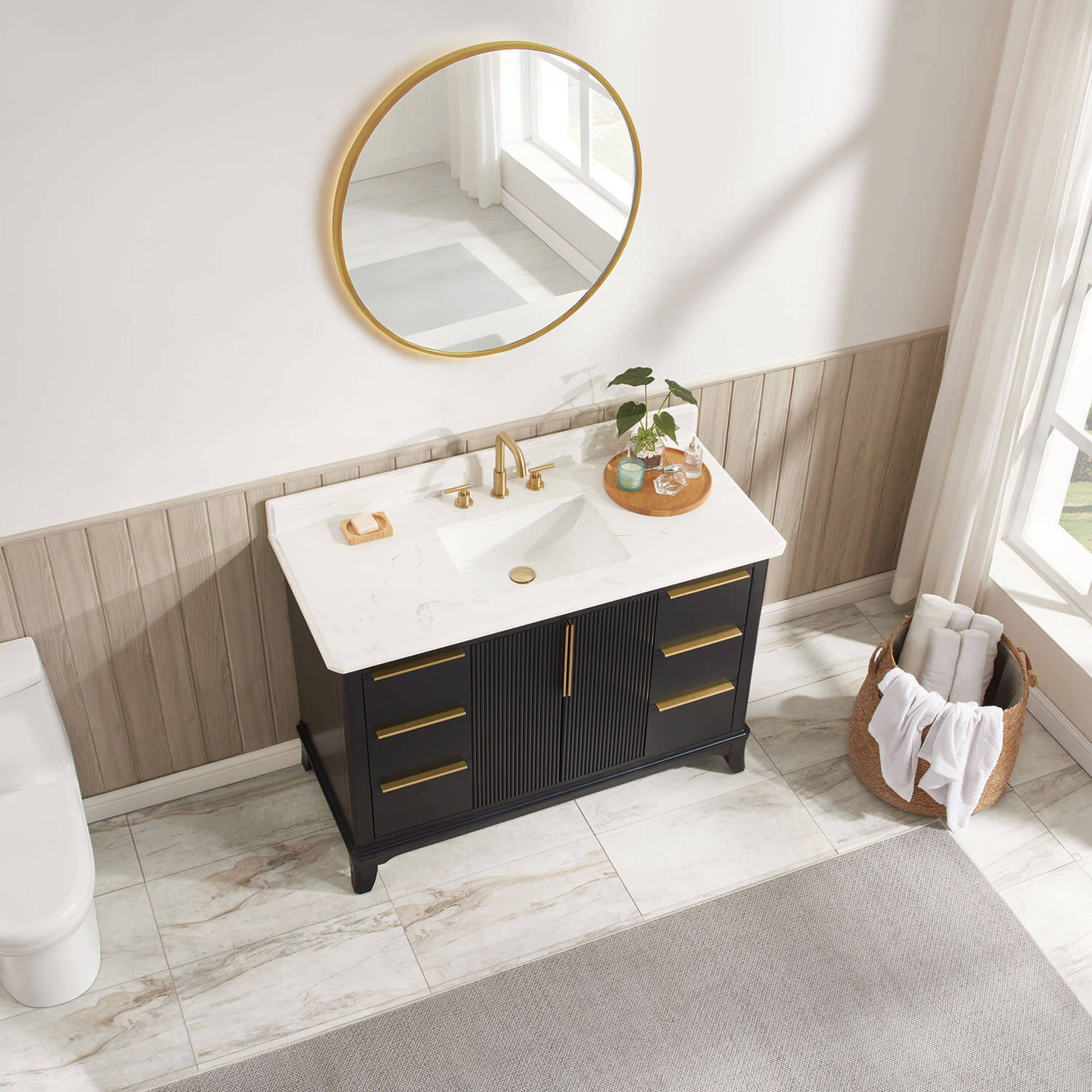 White ceramic rectangular undermount sink with engineered stone vanity top