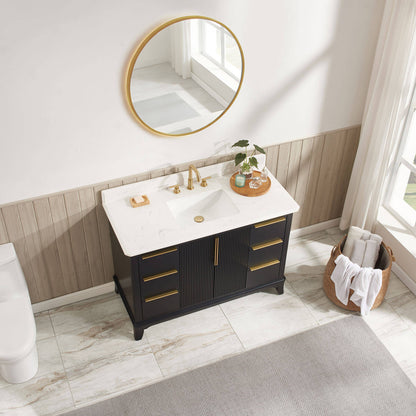 White ceramic rectangular undermount sink with engineered stone vanity top