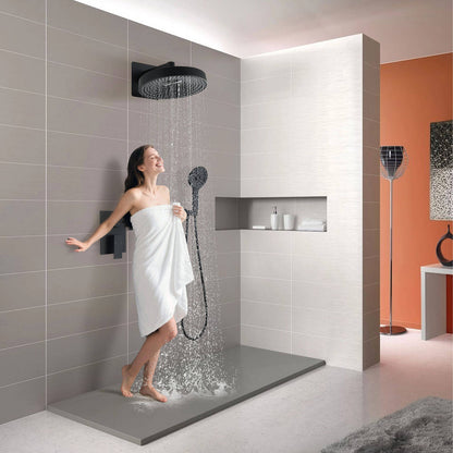 Woman stand under a 12 inch Round Wall-Mounted Shower System