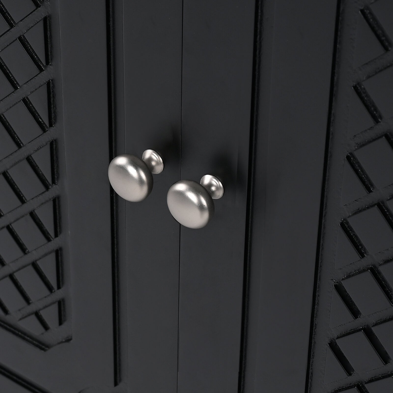 detailed cabinet door carvings on matte black bathroom vanity