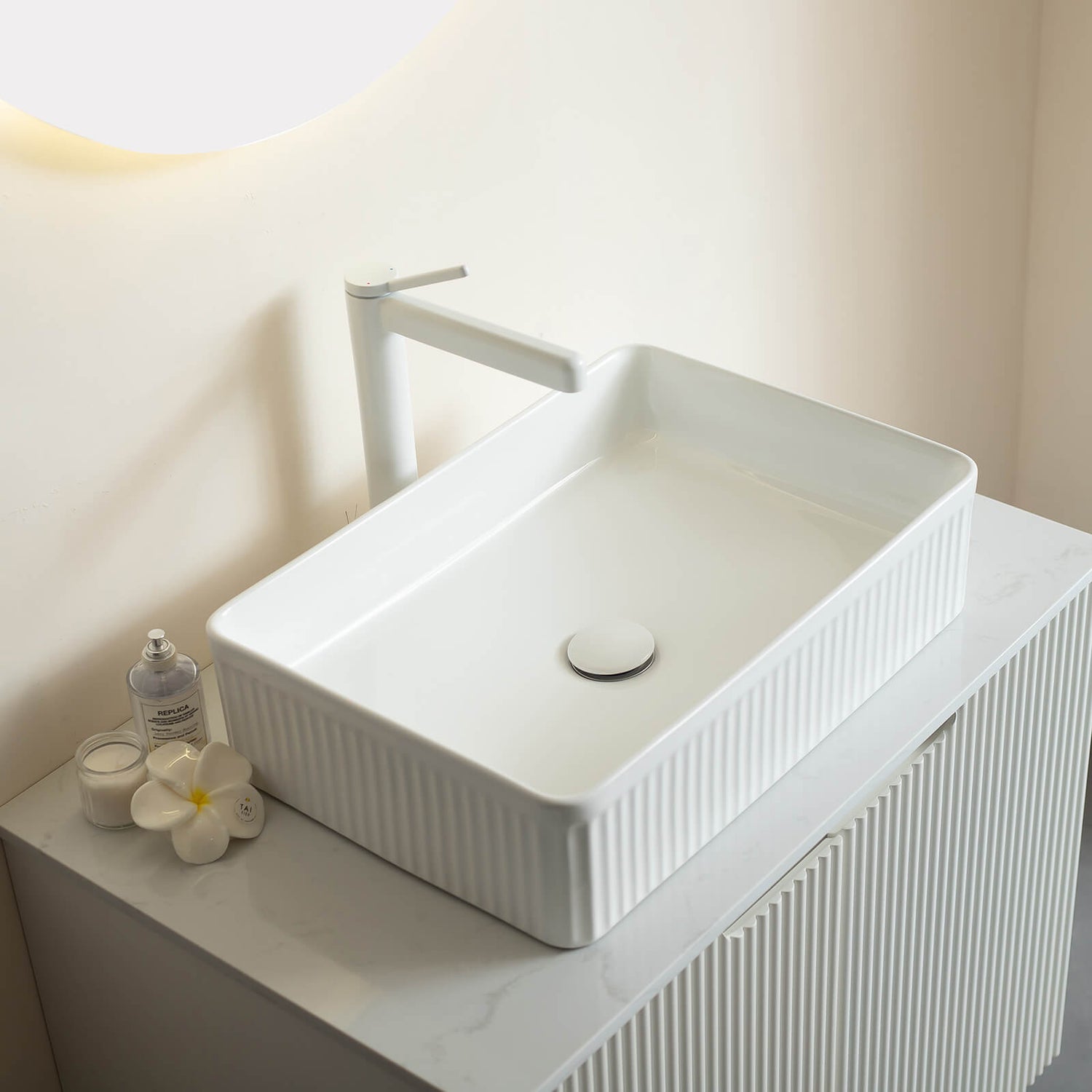 freestanding white vanity with sintered stone countertop