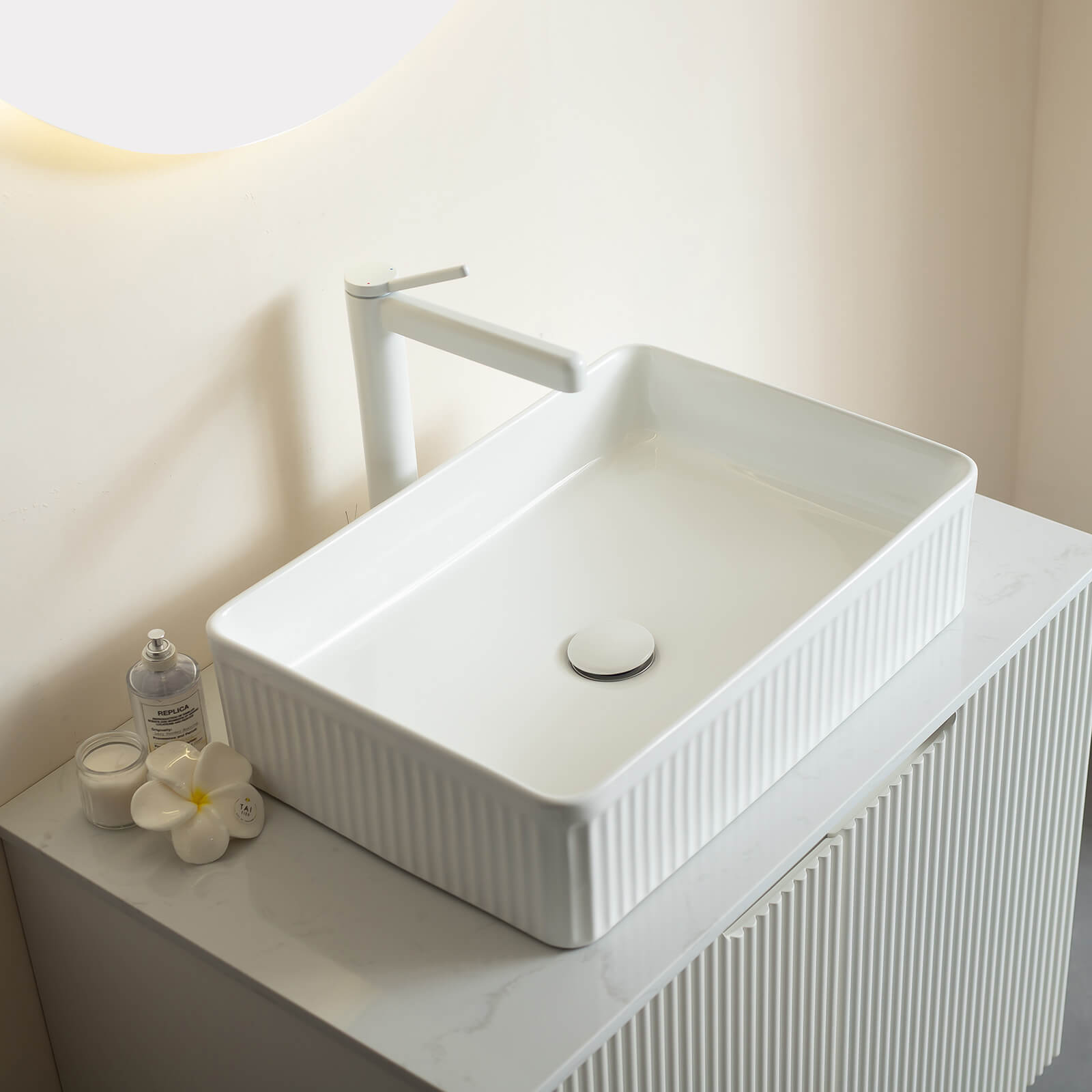 freestanding white vanity with sintered stone countertop
